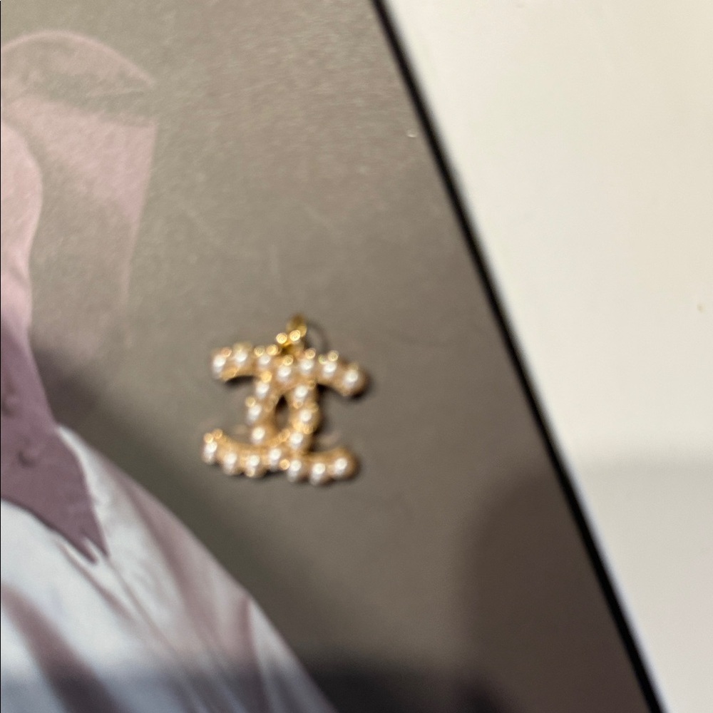 CHANEL Gold and Cream Logo Pendant